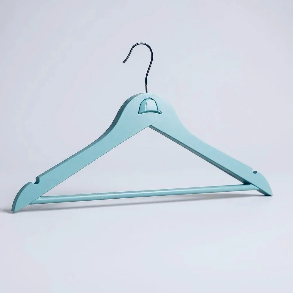 Teal Hanger with Angled Shoulders for the Equestrian attire adorned with helmet.